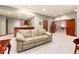 Cozy living room featuring a comfortable couch, carpet, and a bar area at 4245 S Dawson St, Aurora, CO 80014