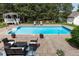 Refreshing pool area with lounge chairs, a charming gazebo, and beautifully landscaped surroundings at 4245 S Dawson St, Aurora, CO 80014