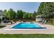 Relaxing pool area with a gazebo, lounge chairs, and privacy landscaping at 4245 S Dawson St, Aurora, CO 80014
