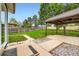 Spacious backyard with a covered pergola and landscaped areas at 18662 E Brown Pl, Aurora, CO 80013