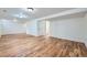 The spacious unfinished basement features hardwood floors, neutral walls and access to utilities at 18662 E Brown Pl, Aurora, CO 80013