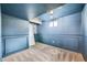 Finished basement area features painted walls with wainscoting and plush carpeting at 18662 E Brown Pl, Aurora, CO 80013