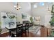 Open concept living room and dining area with hardwood floors and lots of natural light at 5149 S Malta Way, Centennial, CO 80015