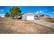 Spacious two-car garage with a paved driveway, providing ample parking and storage space at 34241 E Columbine Trl, Elizabeth, CO 80107