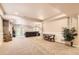 Finished basement includes seating, a table, and a plant to liven the room at 7758 Edgewater Ct, Lone Tree, CO 80124