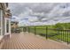 Outdoor wooden deck boasts a grill and views of the surrounding neighborhood at 7758 Edgewater Ct, Lone Tree, CO 80124