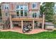 Back of the home features multi-level decks and patios along with a relaxing hot tub at 7758 Edgewater Ct, Lone Tree, CO 80124