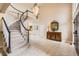 Elegant foyer with a curved staircase, tile flooring, and stylish decor at 7758 Edgewater Ct, Lone Tree, CO 80124