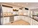 Well-lit kitchen featuring granite countertops, tiled backsplash, and sleek stainless steel appliances at 7758 Edgewater Ct, Lone Tree, CO 80124