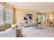 Bright living room with neutral tones, comfortable seating, and ample natural light at 7758 Edgewater Ct, Lone Tree, CO 80124