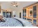 Vaulted ceiling main bedroom featuring custom built-ins for storage and lots of natural light at 7758 Edgewater Ct, Lone Tree, CO 80124