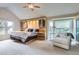 Cozy main bedroom retreat with built-in storage, large windows, and a relaxing seating area at 7758 Edgewater Ct, Lone Tree, CO 80124
