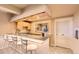 Basement wet bar with granite counters, pendant lighting and a window at 7758 Edgewater Ct, Lone Tree, CO 80124