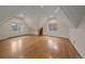 Spacious attic features hardwood floors and dormer windows, creating a versatile living space at 371 Birch St, Denver, CO 80220