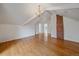 Bright attic space featuring hardwood floors, exposed brick, and versatile layout at 371 Birch St, Denver, CO 80220