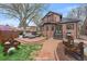 Brick patio with outdoor seating area perfect for enjoying the backyard and entertaining guests at 371 Birch St, Denver, CO 80220