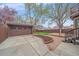 Exterior of a home featuring a detached garage, grass, and patio at 371 Birch St, Denver, CO 80220