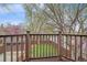 Exterior shot from balcony overlooking a backyard, showcasing a green lawn and privacy fence at 371 Birch St, Denver, CO 80220