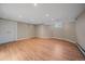 Spacious finished basement features hardwood floors and neutral walls, ready for flexible use at 371 Birch St, Denver, CO 80220