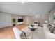 Finished basement area offers a cozy entertainment space with neutral colors and modern furniture at 371 Birch St, Denver, CO 80220