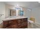 Bathroom with a double sink vanity and a commode at 371 Birch St, Denver, CO 80220