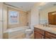 Bathroom features a vanity, a toilet and a tub with shower in it at 371 Birch St, Denver, CO 80220