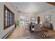 Elegant dining room with chandelier, hardwood floors and window featuring view of the outdoors at 371 Birch St, Denver, CO 80220