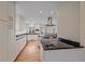 Spacious kitchen with white cabinets, black countertops, and stainless steel appliances at 371 Birch St, Denver, CO 80220