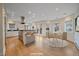 Spacious, well-lit kitchen with island seating, stainless steel appliances, and casual dining area at 371 Birch St, Denver, CO 80220