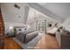 Bright main bedroom featuring a private balcony, vaulted ceiling, and modern finishes at 371 Birch St, Denver, CO 80220
