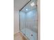 Enclosed glass shower with tile surround, recessed lighting, and modern fixtures at 371 Birch St, Denver, CO 80220