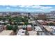 Expansive aerial view capturing the city skyline, surrounding neighborhoods, and distant mountain range at 1266 N Pearl St, Denver, CO 80203