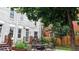 Charming backyard with a patio dining area, lush landscaping, and a well-maintained lawn at 1266 N Pearl St, Denver, CO 80203