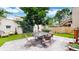 Beautiful backyard featuring an outdoor dining area, privacy fence, and a well-manicured lawn at 1266 N Pearl St, Denver, CO 80203