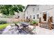 Inviting backyard with paved patio, perfect for outdoor dining and entertaining, surrounded by lush greenery at 1266 N Pearl St, Denver, CO 80203