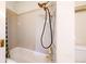 Bright bathroom showcasing a vintage shower head and tiled walls at 1266 N Pearl St, Denver, CO 80203