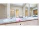 Bright bathroom featuring double sinks, a shower, and a skylight for natural lighting at 1266 N Pearl St, Denver, CO 80203
