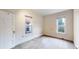 Cozy bedroom with neutral tones, two large windows, and trim at 1266 N Pearl St, Denver, CO 80203