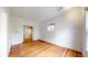 Bright bedroom with hardwood floors, offering a cozy retreat and easy access to an ensuite bathroom at 1266 N Pearl St, Denver, CO 80203