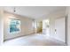 Bright bedroom with large windows and access to a small, private bathroom at 1266 N Pearl St, Denver, CO 80203