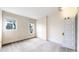 Bright bedroom featuring two windows, neutral walls, and classic trim at 1266 N Pearl St, Denver, CO 80203