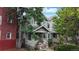 Lovely two-story home with mature trees, a well-maintained yard, and a welcoming front porch in a quiet neighborhood at 1266 N Pearl St, Denver, CO 80203