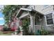 Charming front porch with brick columns and flowering plants at 1266 N Pearl St, Denver, CO 80203