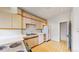 Bright kitchen with updated appliances, ample counter space, and original flooring at 1266 N Pearl St, Denver, CO 80203