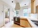Bright kitchen with updated appliances, a double basin sink, and a large window at 1266 N Pearl St, Denver, CO 80203