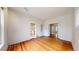 Large living room with hardwood floors, providing ample space for various uses, with easy access to the kitchen at 1266 N Pearl St, Denver, CO 80203