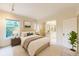 Well staged bedroom with an ensuite bathroom and a large picture window at 1266 N Pearl St, Denver, CO 80203