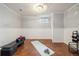 Basement workout area with natural light, exercise equipment, and a clean aesthetic at 1667 S Balsam Ct, Lakewood, CO 80232