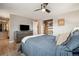 View of a bedroom featuring carpet, a dresser, TV, closet, and full sized bed at 1667 S Balsam Ct, Lakewood, CO 80232