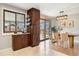 Dining area with custom cabinetry, hardwood floors, and a sliding glass door to the patio at 1667 S Balsam Ct, Lakewood, CO 80232